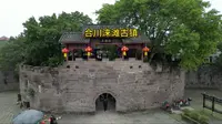 游览重庆合川有着千年历史的涞滩古镇，是川渝地区罕见的古代军事遗迹，来这里感受千年古镇的人间烟火